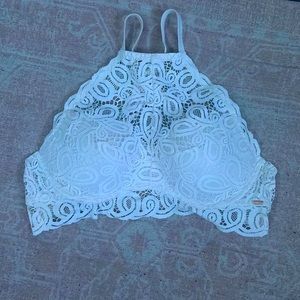 Pink bra , Size L , White lace with pink pads on the inside , adjustable strap